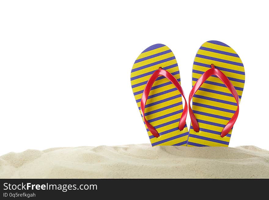 Flip flops in clear sea sand. Summer vacation