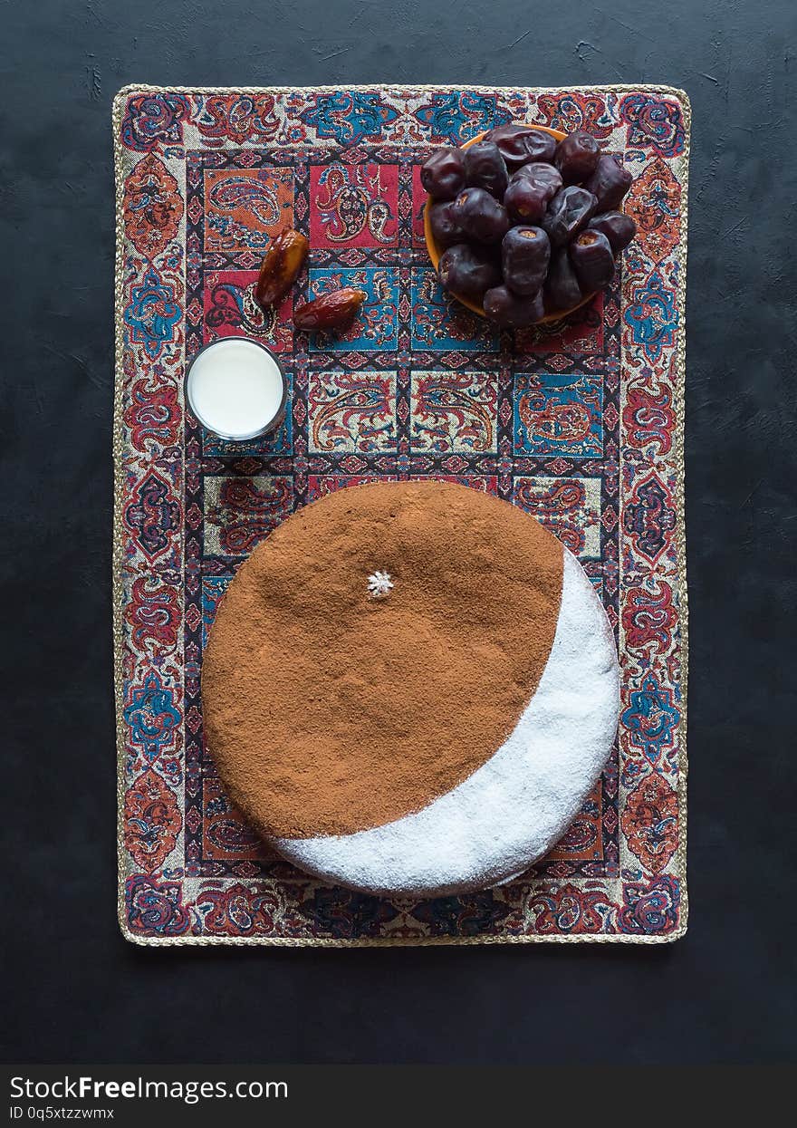 Healthy and delicious dates and cashew nut cake with crescent moon. Ramadan background.