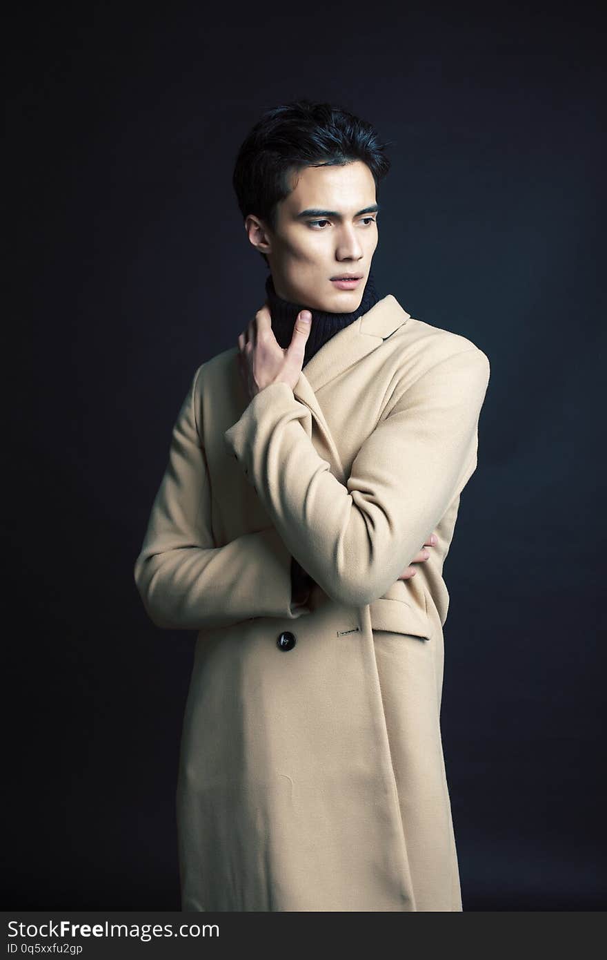 Handsome asian fashion looking man posing in studio on black background, lifestyle modern people concept