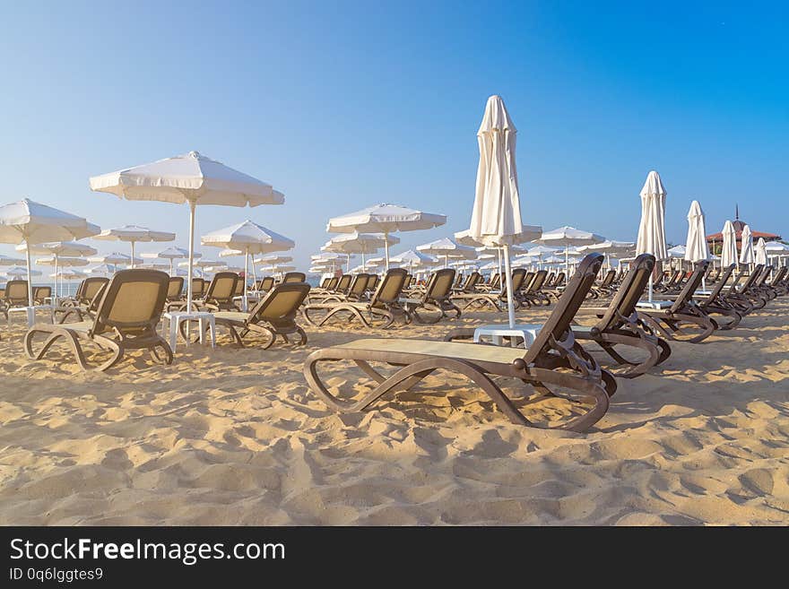 Chairs and umbrellas on a beautiful beach at sunrise in Sunny Beach on the Black Sea coast of Bulgaria