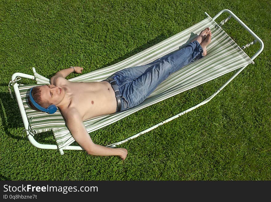 The Guy Is Resting In A Hammock