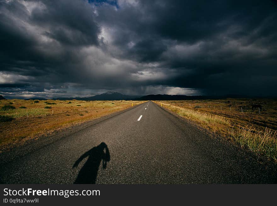 Nature of Iceland, dramatic sky and storm, and the road