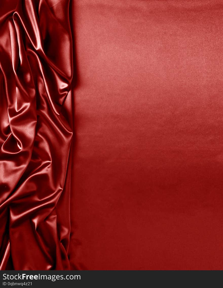 Smooth elegant red silk or satin texture can use as abstract background. Luxurious background design