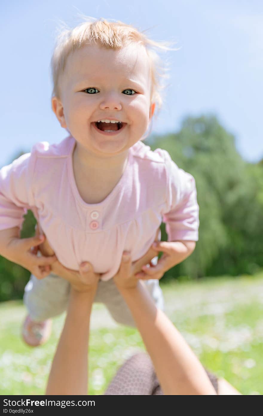 Happy Mom with Baby in the Summer Meadow Have Fun. Happy Mom with Baby in the Summer Meadow Have Fun