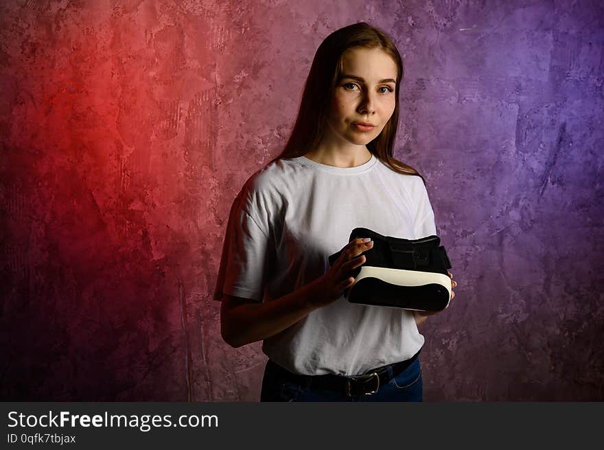 Happy young woman using a virtual reality headset