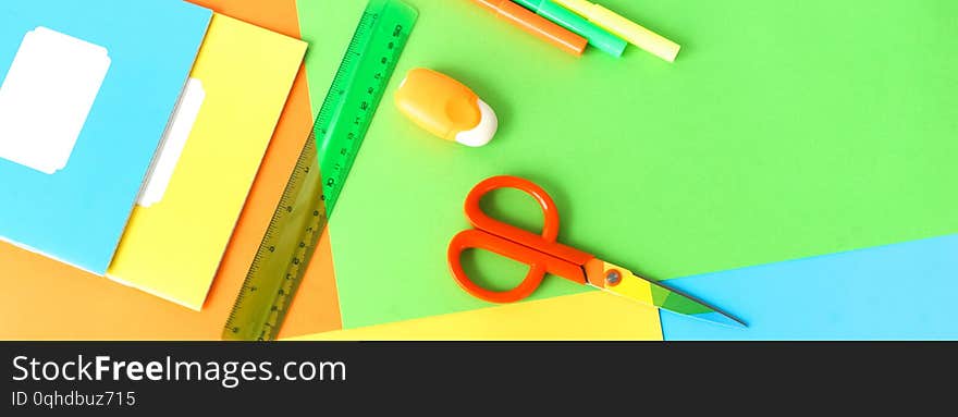 Banner back to school background. School supplies bright colors at abstract colored background. Education concept. Top view. Copy space