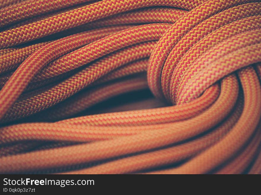 Orange rope for climbing and climbing. background image of the rope for active sports. Orange rope for climbing and climbing. background image of the rope for active sports