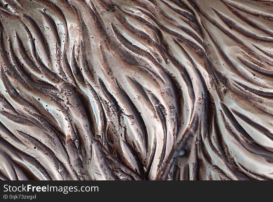 Details and decorative bas-relief ornament from metal of forged stamping iron gate as background texture