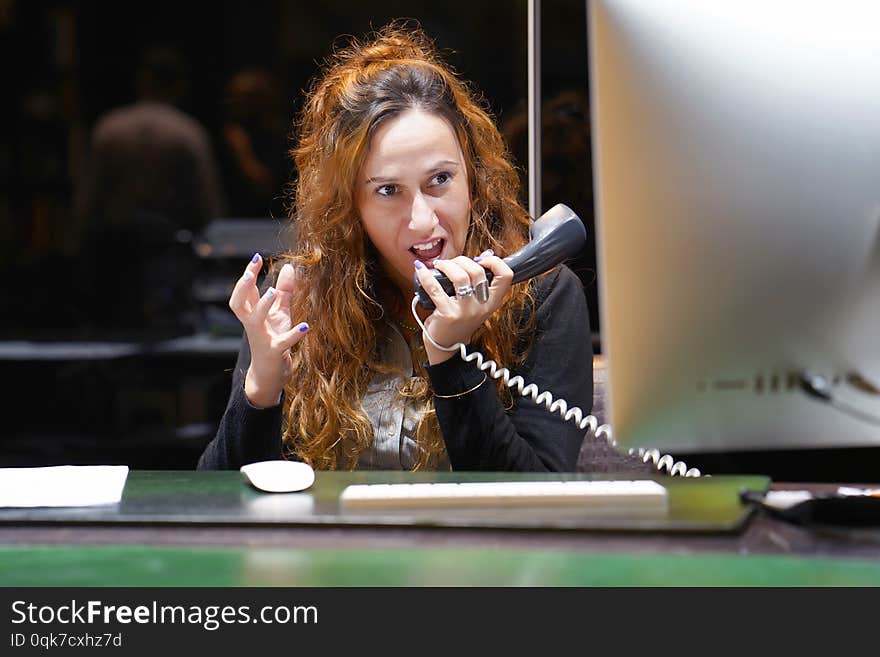 A office woman in stress. A lot of phone calls in office. An office worker female shouting in the phone`s. Funny face expression, emotions. Feelings problem reaction. A office woman in stress. A lot of phone calls in office. An office worker female shouting in the phone`s. Funny face expression, emotions. Feelings problem reaction