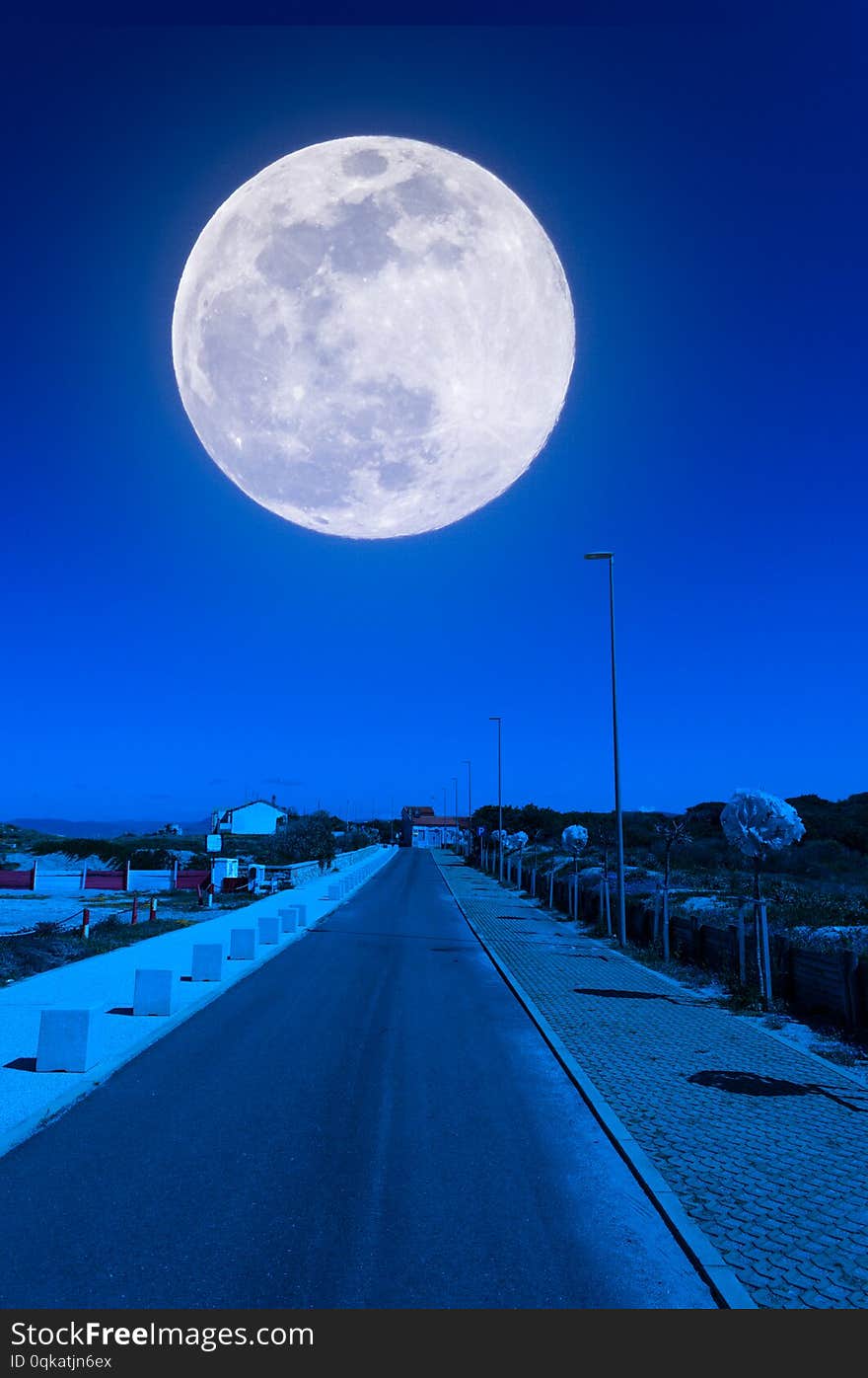 Desert road near the beach at night with super moon, blue, sky, landscape, sea, nature, full, light, background, moonlight, dark, water, lunar, ocean, black, wave, beautiful, space, romantic, scene, tranquil, horizon, calm, astronomy, supermoon