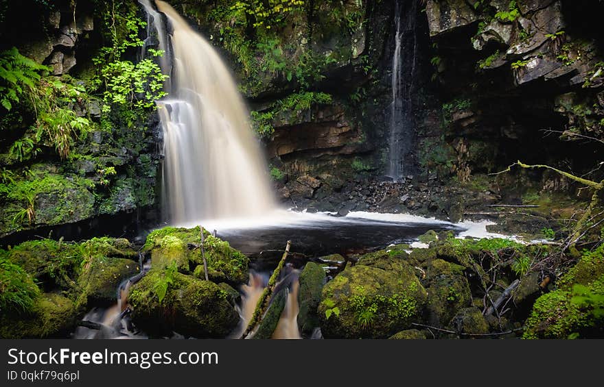 A small, undisturbed and uncultivated waterfall located within a forest in County Donegal, Ireland. A small, undisturbed and uncultivated waterfall located within a forest in County Donegal, Ireland.