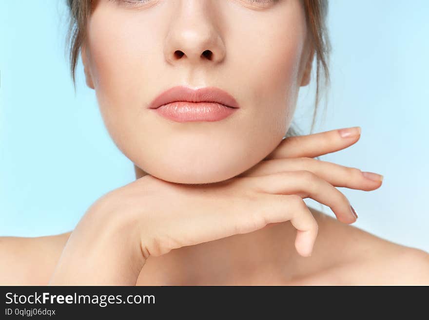 Beautiful young woman with silky skin on color background, closeup