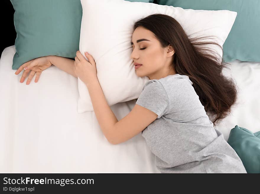 Young beautiful woman sleeping in morning at home