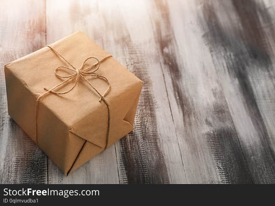 Beautiful gift box on wooden background