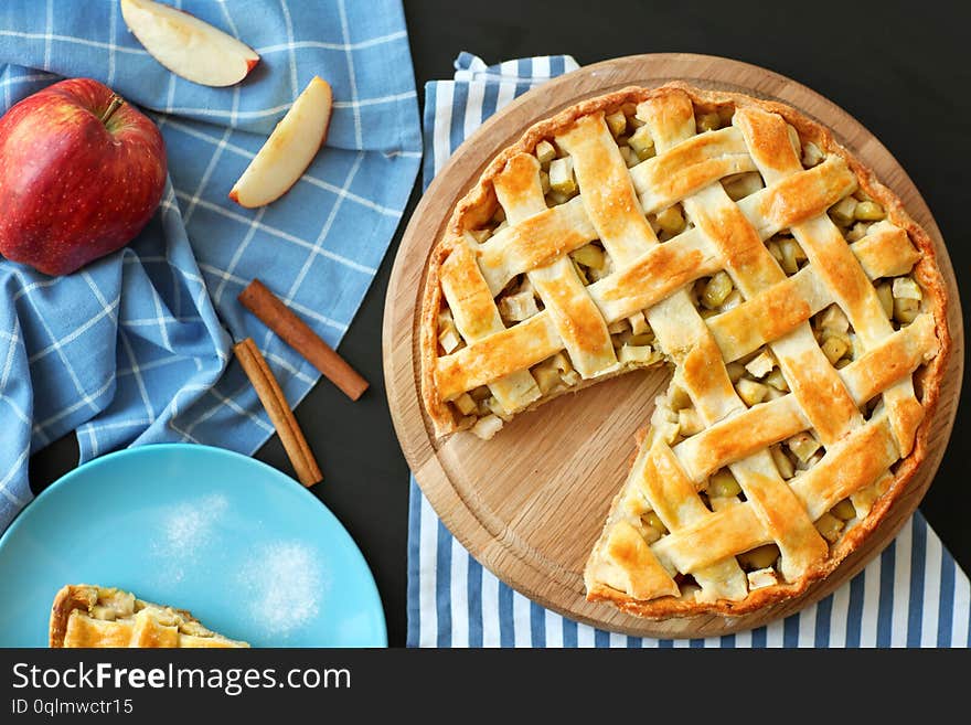 Composition with tasty homemade apple pie on table