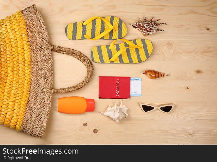 Composition with tourist's stuff on wooden background, top view