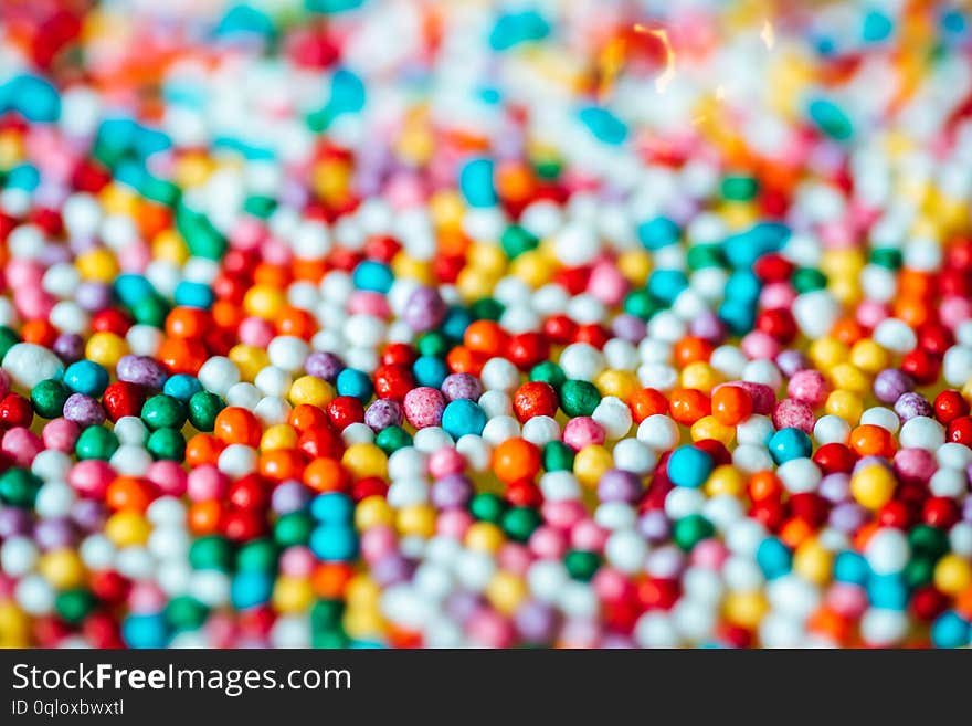 Multicolored Candy On A Green Background