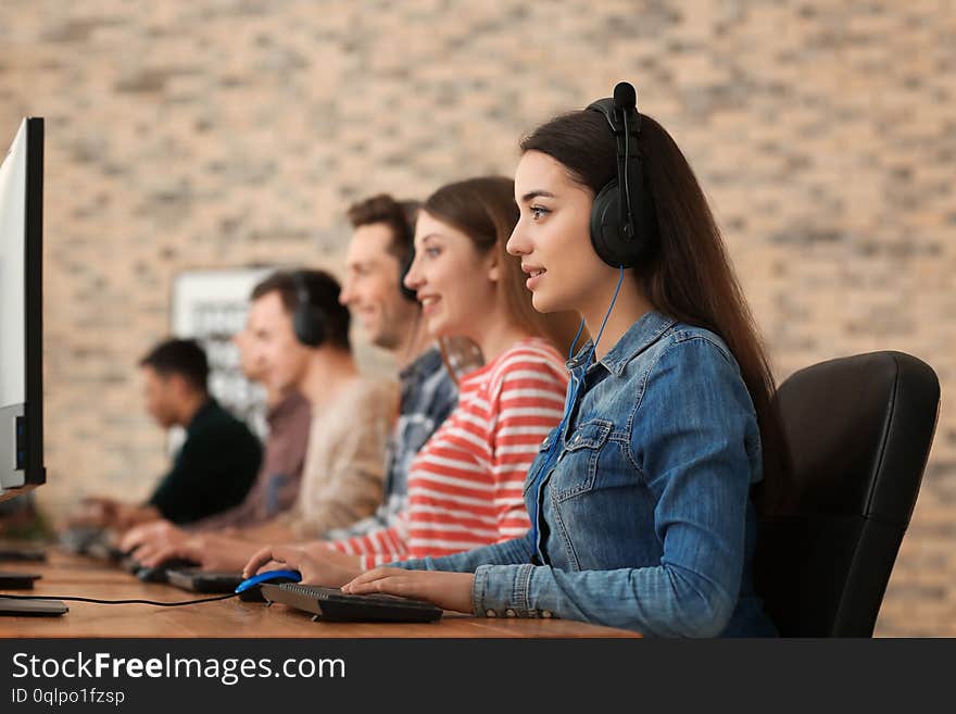 Young people playing video games at tournament