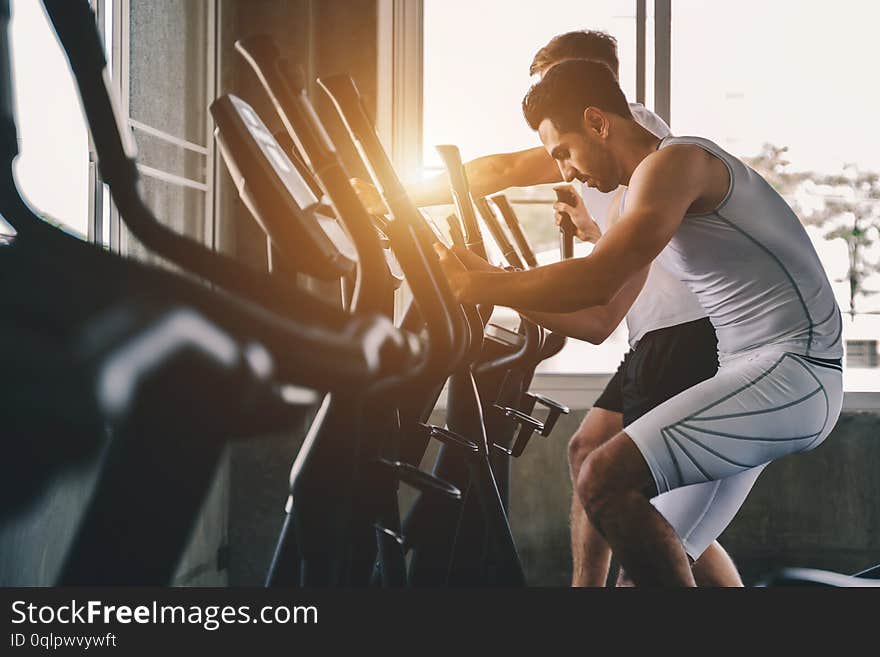 Group of young people doing exercises in gym ,fitness concept