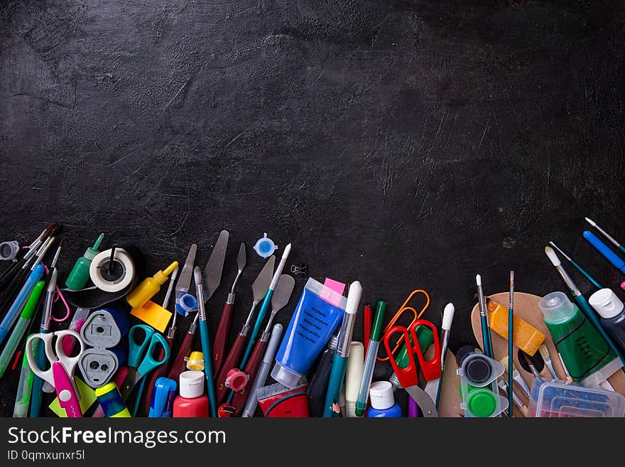 School supplies on blackboard background