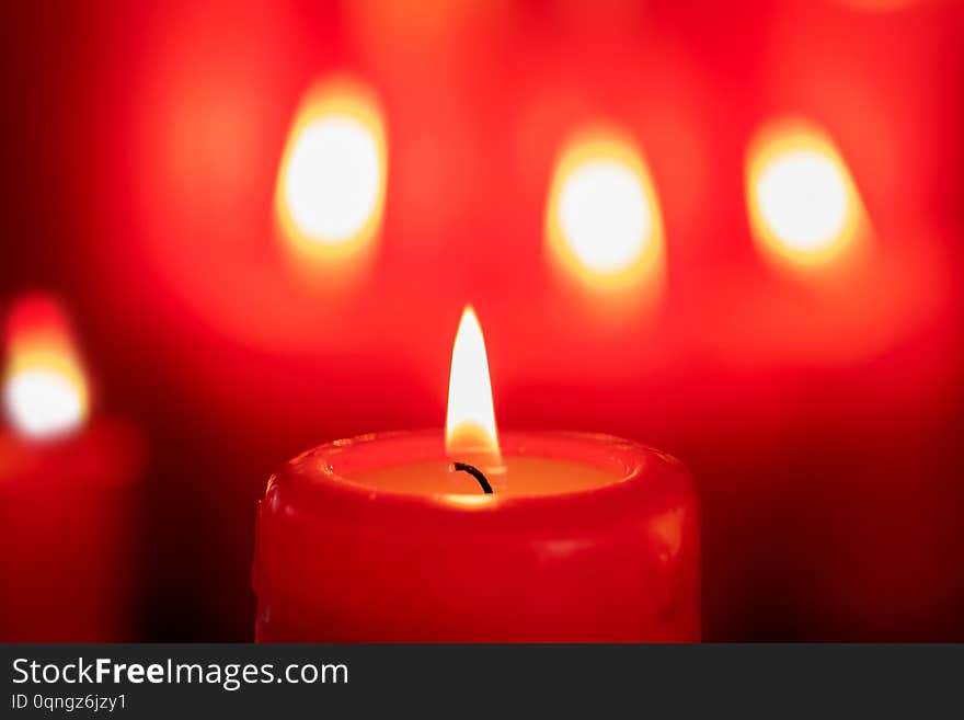 Christmas candles in red. Decoration for holidays. Christmas candles in red. Decoration for holidays