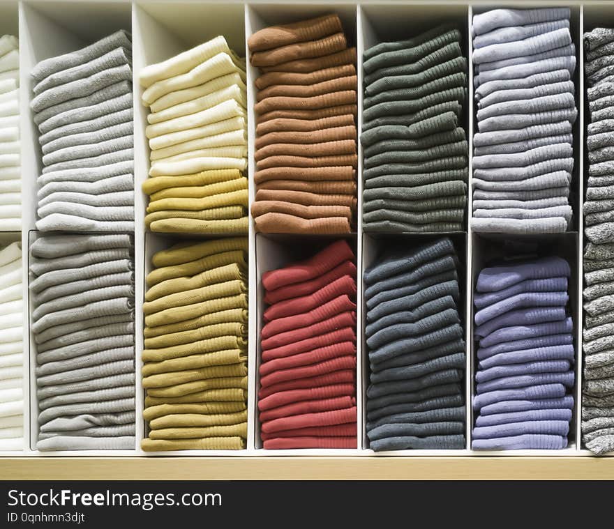 Cotton T-shirt folded neatly in the showroom,Colorful clothes folded in the cabinet,Colorful clothes neatly dressed,Shelves and. Multi-colored clothes in large stores,A row of colorful shirts, background, black, blue, bright, clean, clipping, clothing, collection, colors, design, fabric, fashion, garment, heap, laundry, many, merchandise, pile, retail, sale, selection, shelf, shop, stack, style, t-shirts, tee, textile, texture, tshirt, up, vibrant, wear, white, yellow, showroomcolorful, cabinetcolorful, dressedshelves, storesa