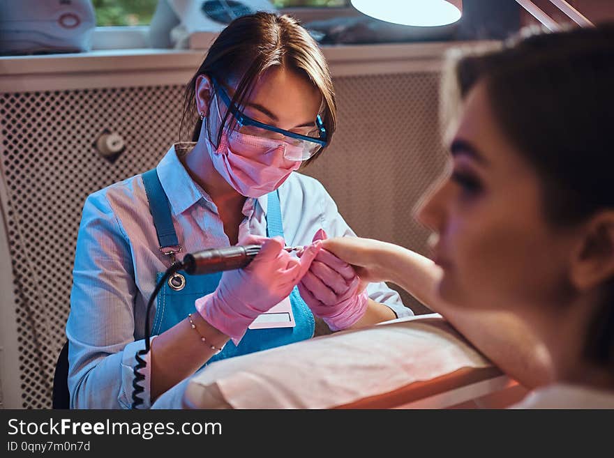 Nail Treatment Process At Busy Manicure Salon.