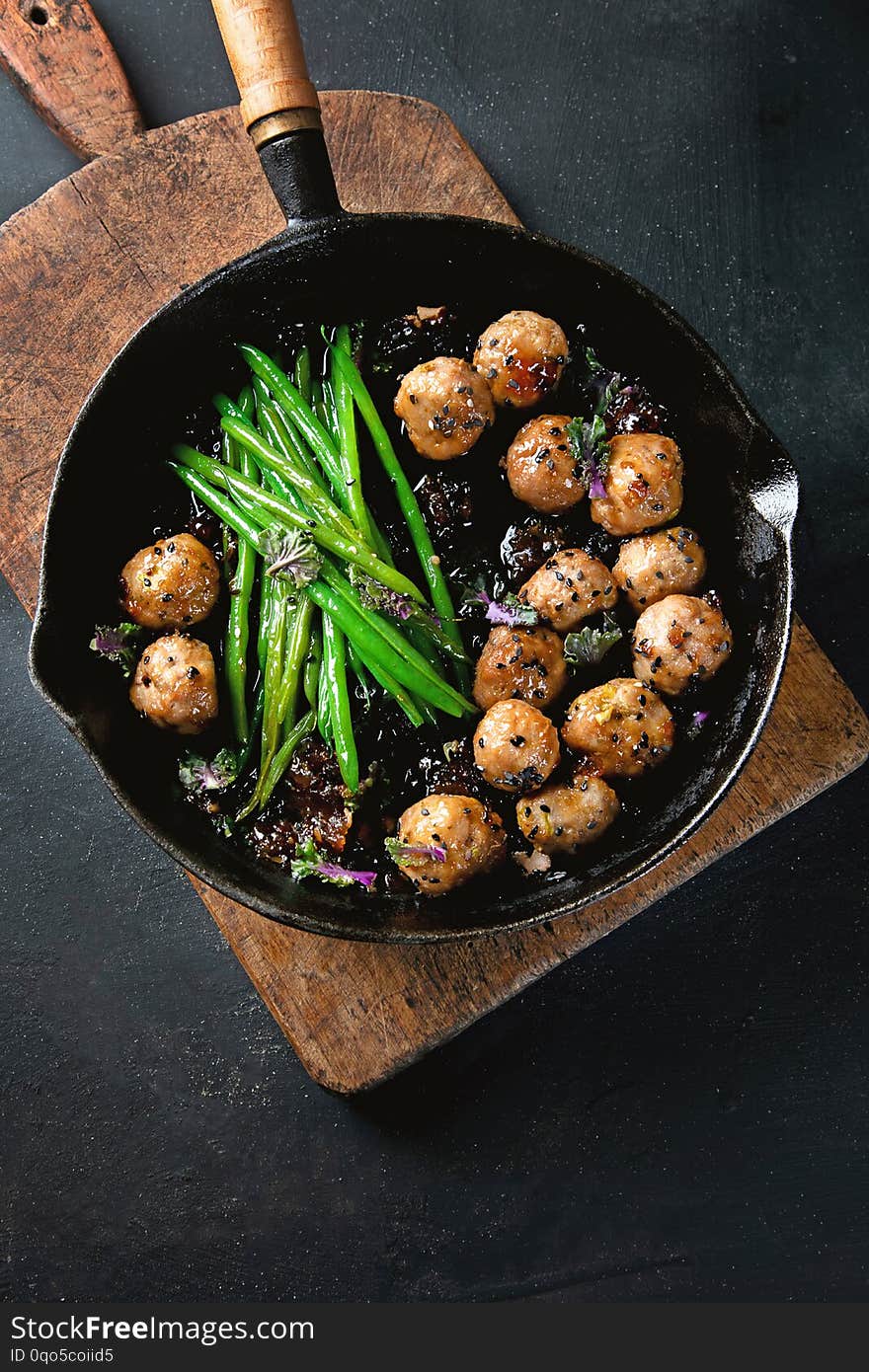 Meatballs, green beans sauce  with sesame and soy sauce