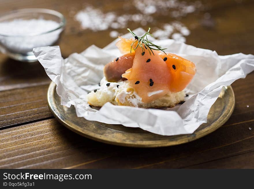 Pretzel with Smoked Salmon, Cream Cheese, Fresh Dill, Black Sesame and Lime