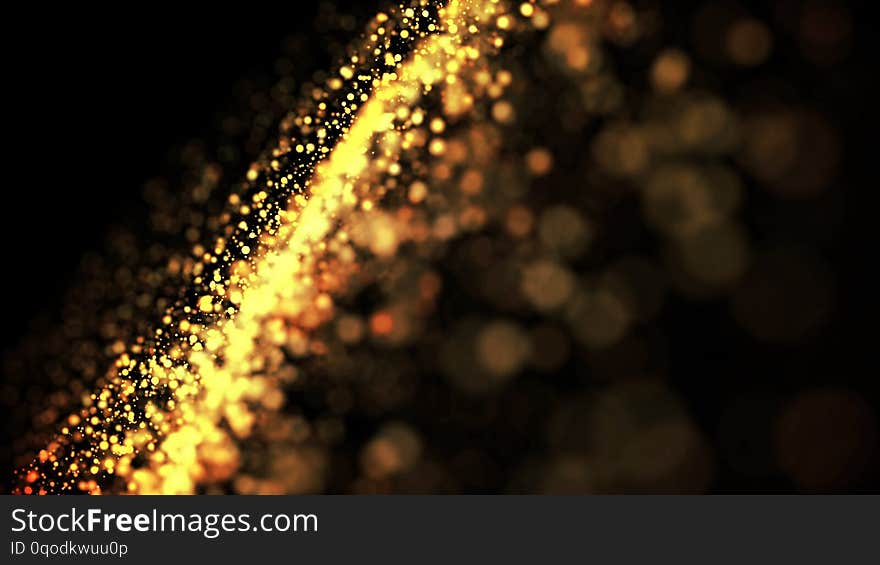 Gold particles glisten in the air, gold sparkles in a viscous fluid have the effect of advection with depth of field and