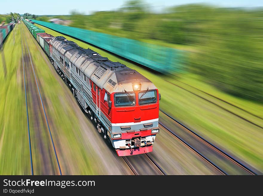 Freight train going in a hurry along the train at high speed. Railway Transport Concept