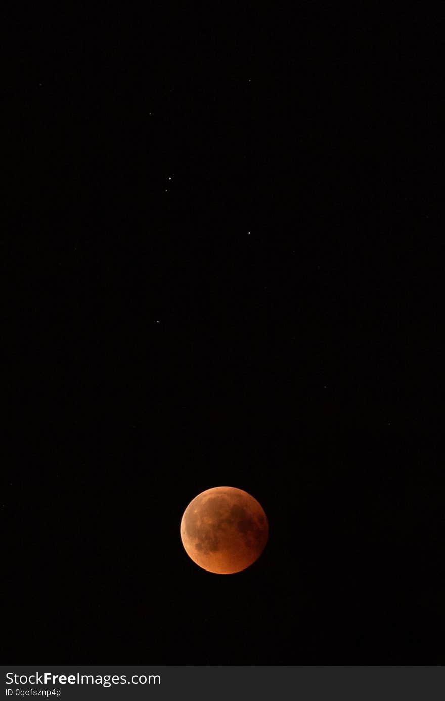 Lunar eclipse in the black night sky