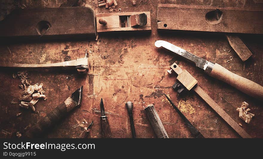 Hand tools Wood Drill Jig Saw plane chisel on an old wooden workbench. Hand tools Wood Drill Jig Saw plane chisel on an old wooden workbench