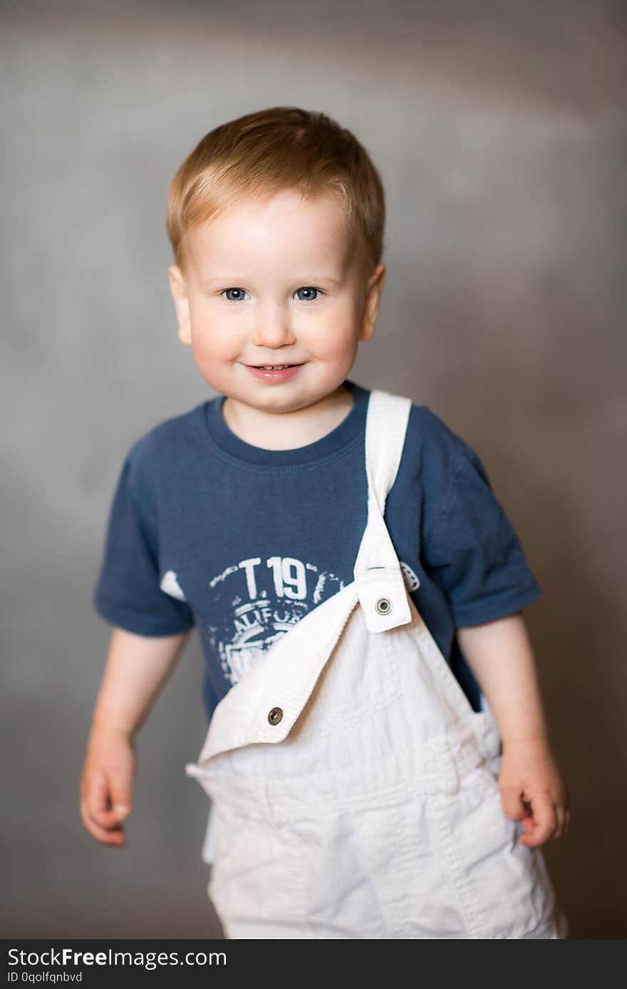 A portrait of a smiling little toddler. A portrait of a smiling little toddler.