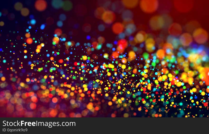A cloud of multicolored particles in the air like sparkles on a dark background with a small depth of field. beautiful bokeh light effects with colored particles. background for holiday presentations. A cloud of multicolored particles in the air like sparkles on a dark background with a small depth of field. beautiful bokeh light effects with colored particles. background for holiday presentations