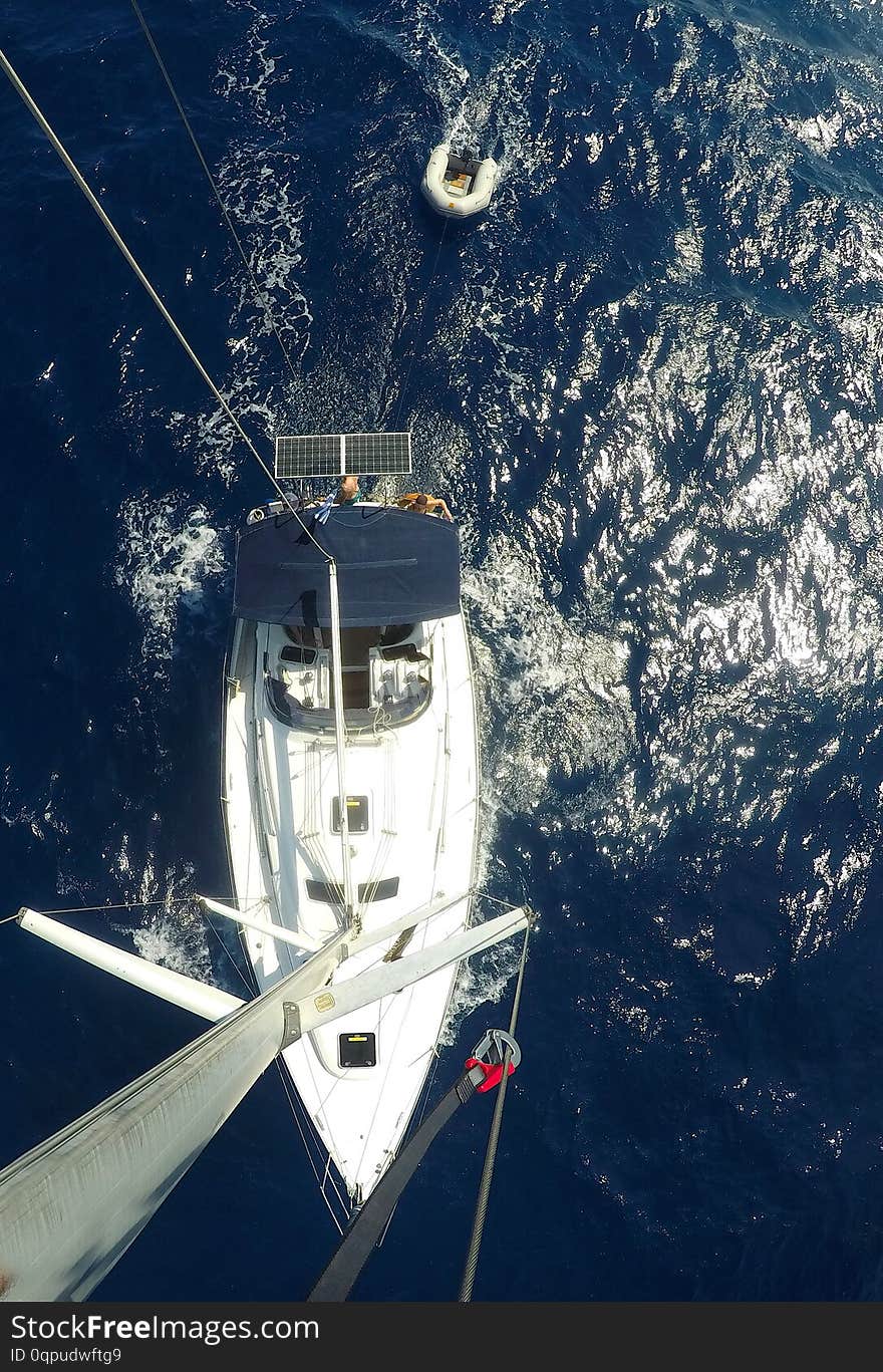 Sailboat action view down from the top of a mast on a sailboat a Birds view actioncam