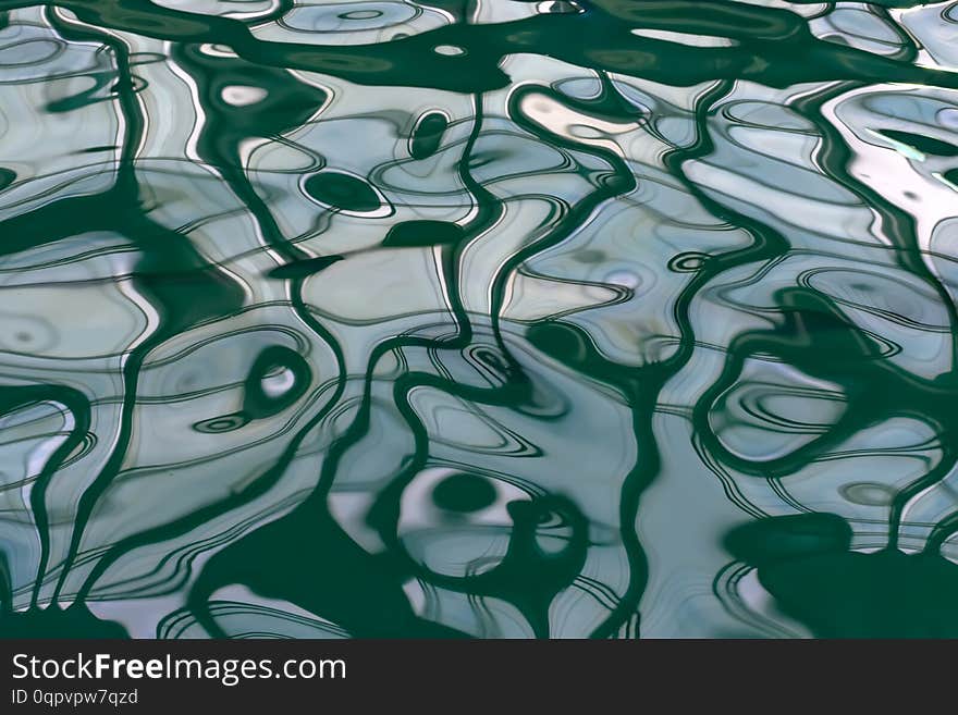 Abstract backgrounds of many colors and curves. Reflection of Windows in the pool water.