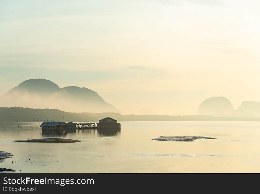 Traditional fisherman house built on sea in the morning, with fog in southern rural of Thailand