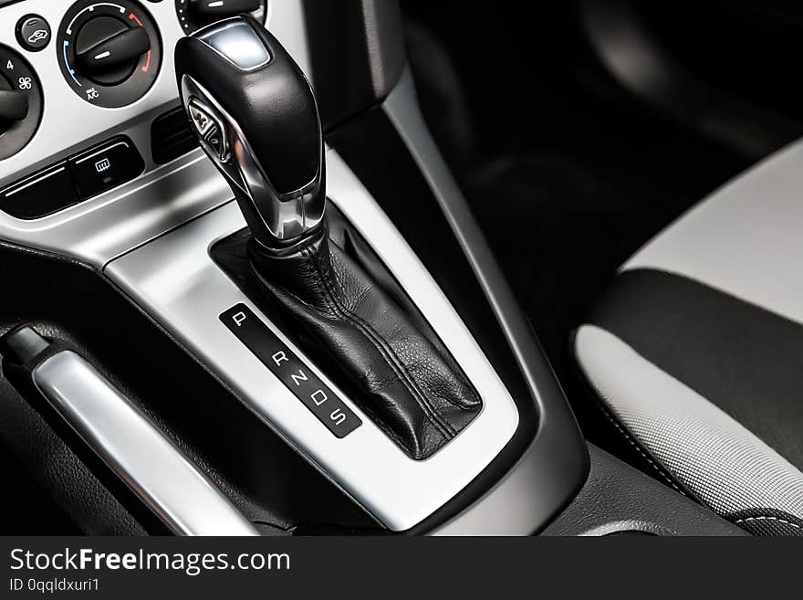 Close-up of the accelerator handle with silver metallic.  automatic transmission gear of car , car interior. Close-up of the accelerator handle with silver metallic.  automatic transmission gear of car , car interior