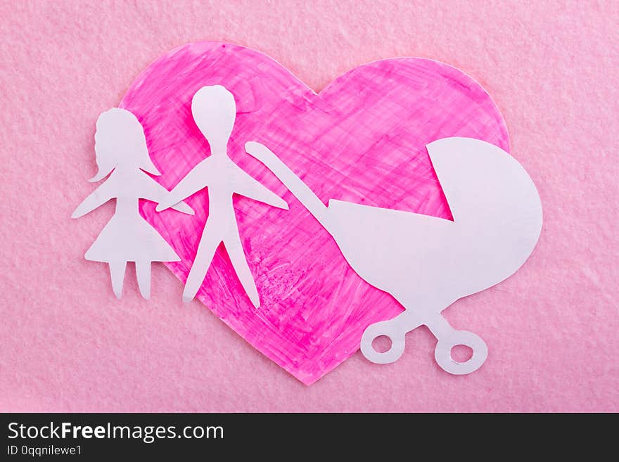 cartoon styled baby carriage on pink background