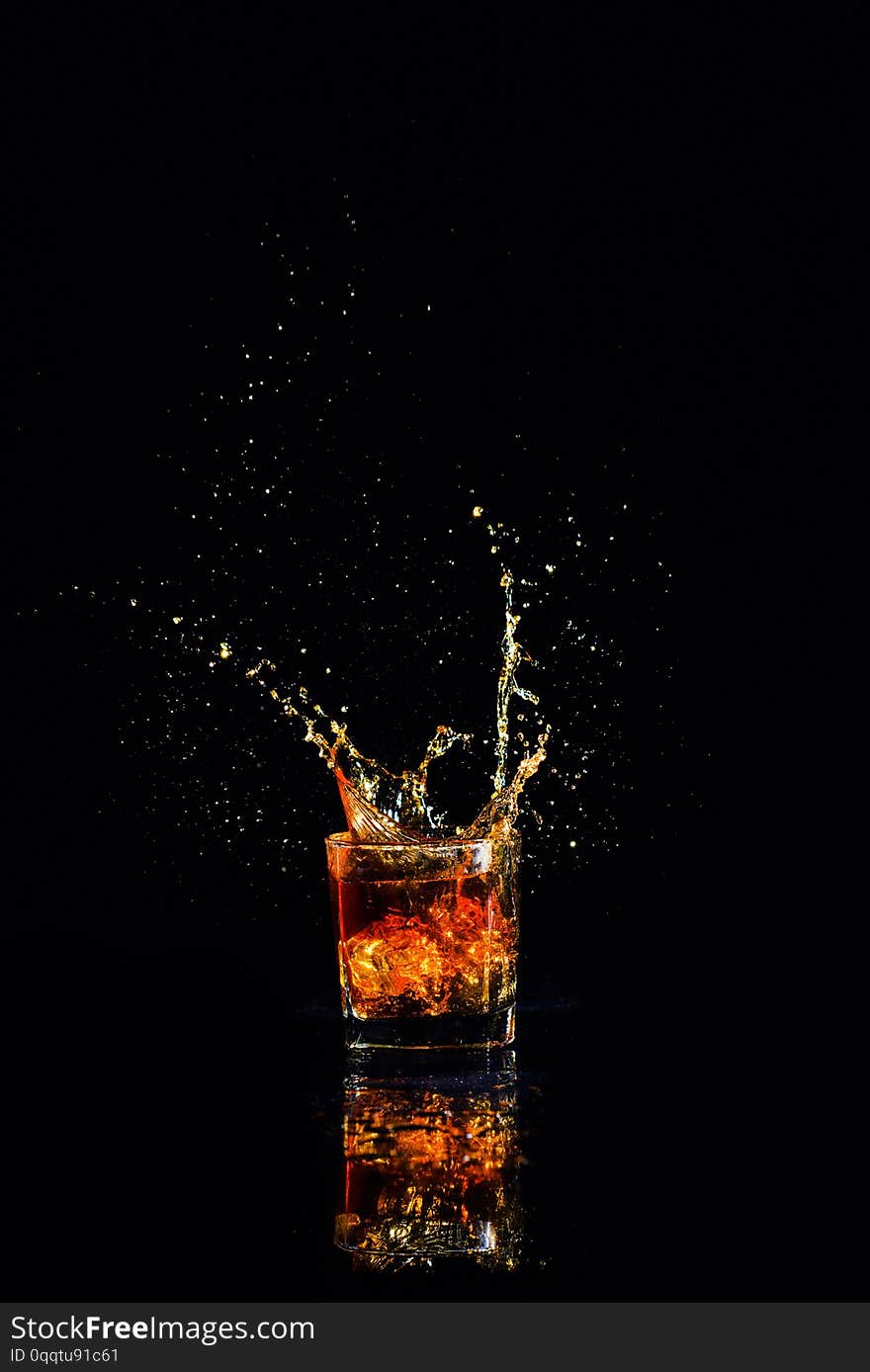 whiskey with splash on black background, brandy in a glass, alcohol, alcoholic, amber, bar, beverage, bottle, bourbon, brown, celebration, close-up, cocktail, cognac, cold, copy, copyspace, cube, dark, drunk, elegance, gold, golden, ice, isolated, life, liquid, liquor, nobody, object, pouring, reflection, relaxation, restaurant, rocks, rum, scotch, shot, single, table, top, whisky, wood, wooden