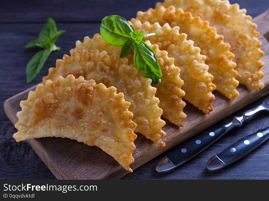 Chebureki - pan fried pie with meat and onions. Fried-dough food.