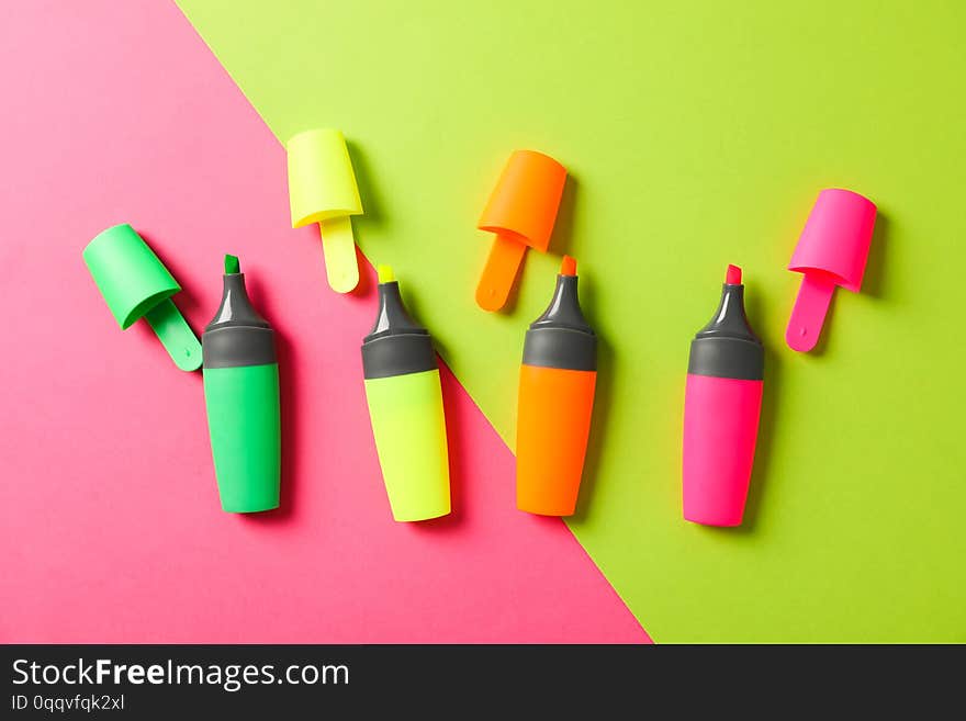 Open highlighters on two tone background, space for text