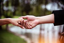 In Selective Focus Of Human Hands Touching Together Royalty Free Stock Photos