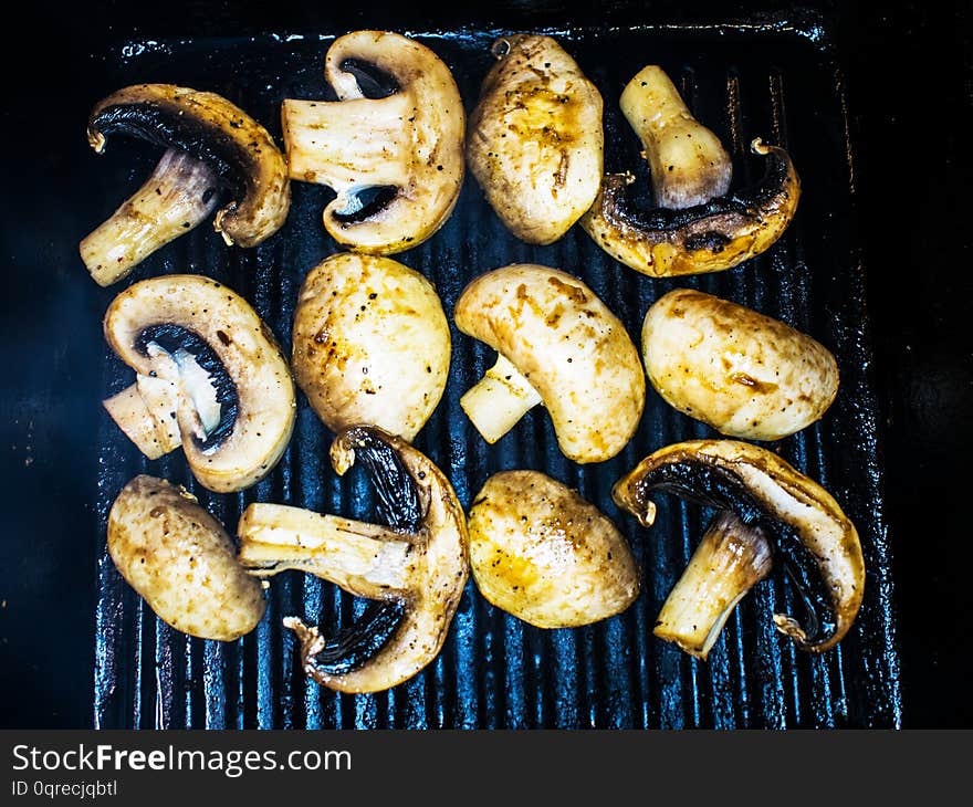 Mushrooms, mushrooms, grilled.  Cooking mushrooms on the grill in the restaurant