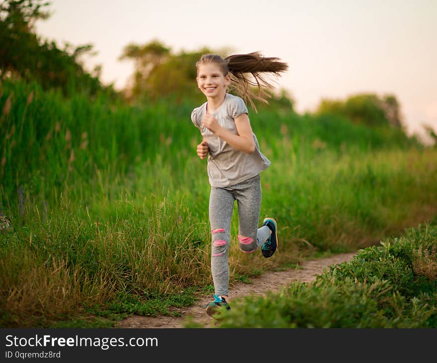 Little Cheerful Girl Running, Playing Sports