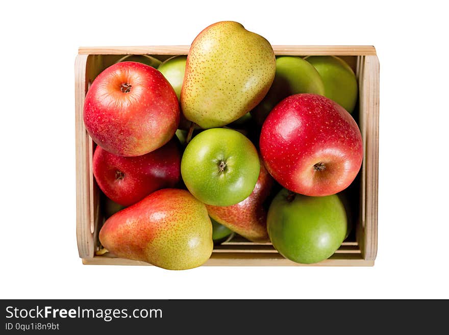 Ripe apples and pears in a wooden box isolated on white background. Autumn seasonal image with top view.