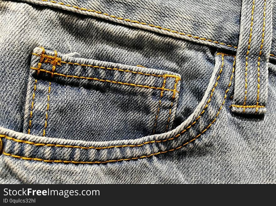 Front right pocket on light-colored jeans.
