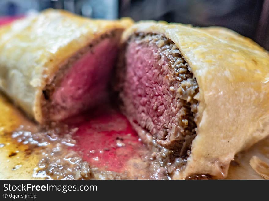 Beef wellington cut in half and ready to be carved