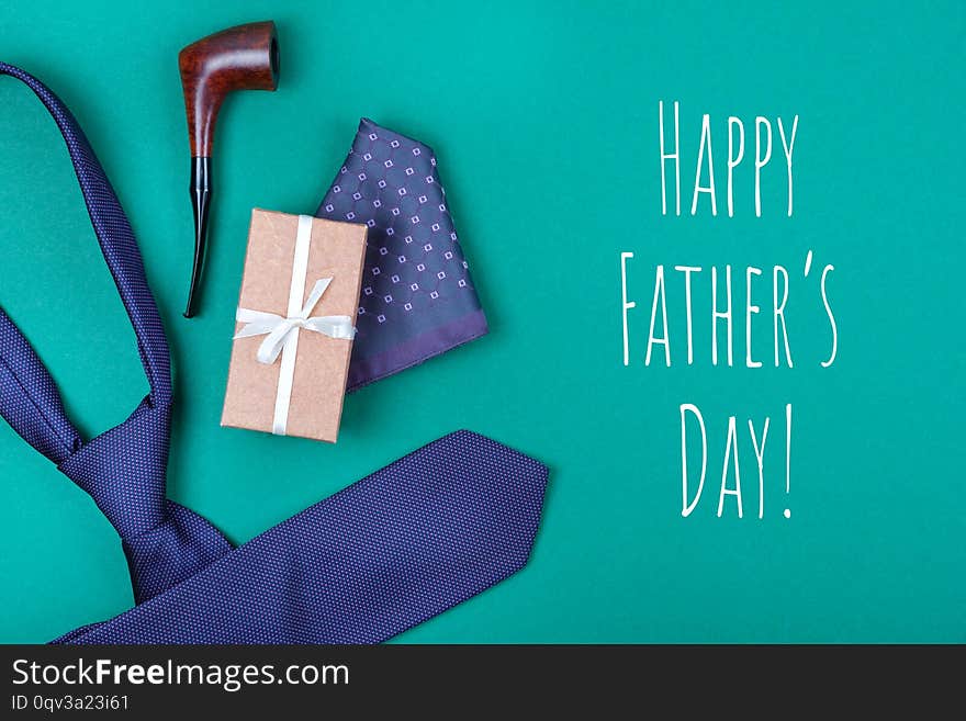 Greeting Card With Violet Neck Tie, Gift Box, Pocket Square And Smoking Tobacco Pipe On With Inscription Happy Father`s Day.